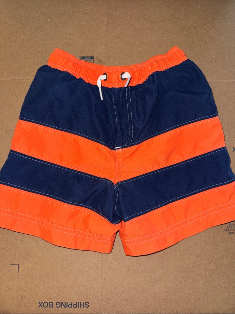 Hanna Andersson Orange and Navy Chevron Kids Swim Trunks
